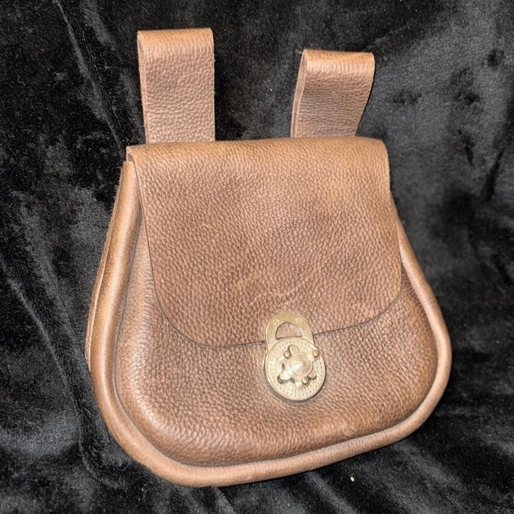 Brown Leather Backpack with Classic Design and Flap Closure